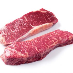 Raw striploin steak. Isolated on white background